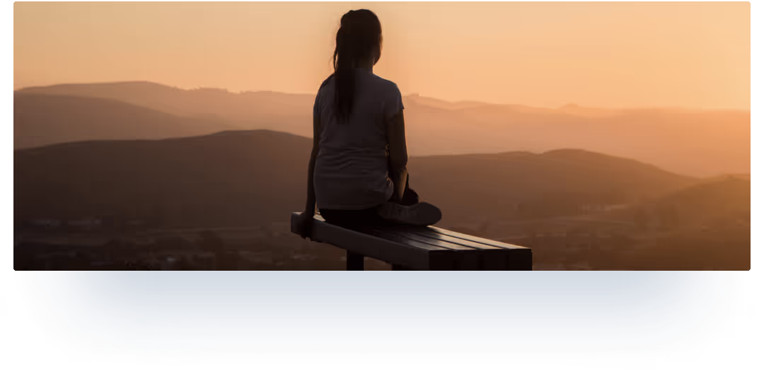 Girl meditates seeing off the sunset